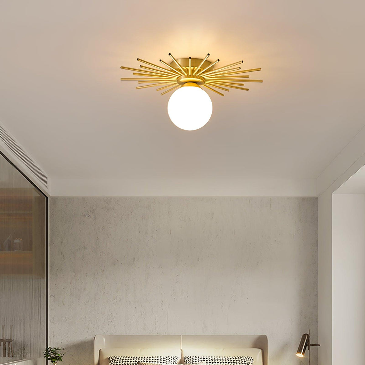 Mounted above a mirrored wardrobe, this Clérachic ceiling light casts its warm glow through the bedroom.
