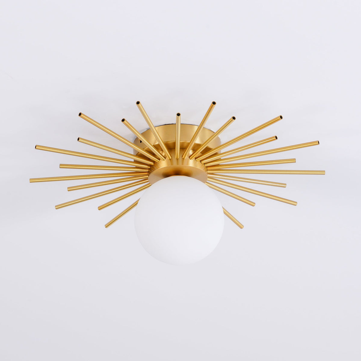 Angled low view of this Clérachic ceiling light on a pale grey backdrop, rods spread wide above the globe.