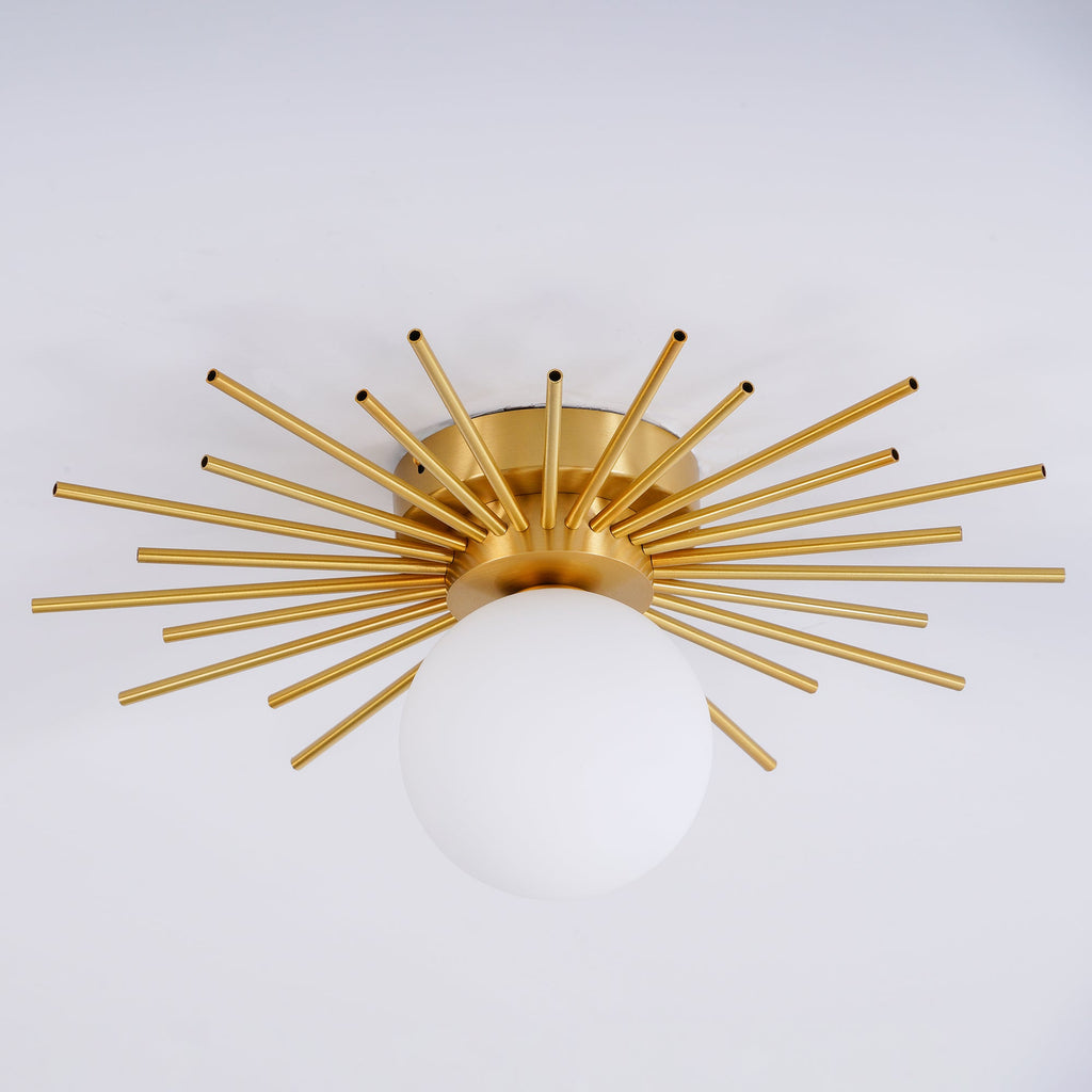 Close angled shot on grey of this Clérachic ceiling light, its brass spikes catching the studio light.