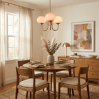 Marshmallow chandelier shown from below with shades glowing