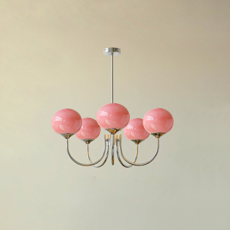 Glass-shade chandelier shown lit against a soft neutral backdrop