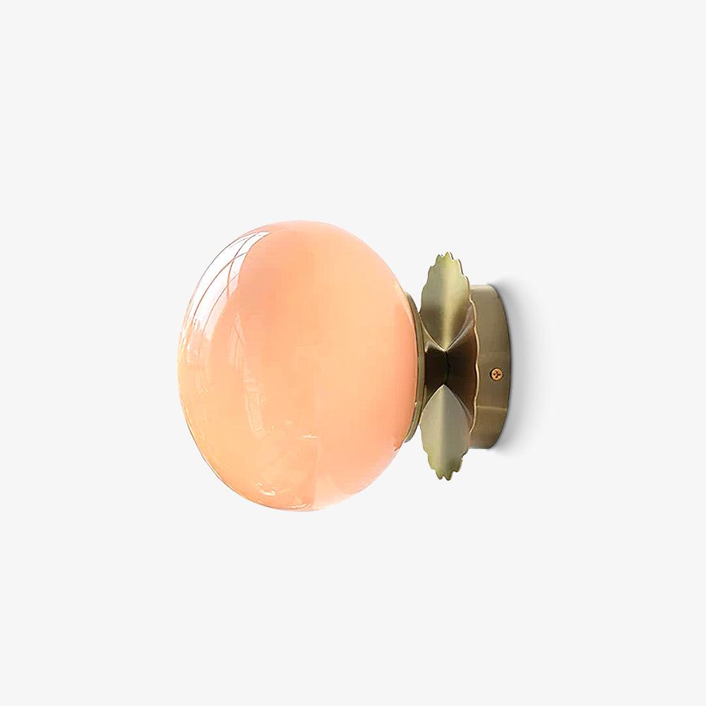 Marshmallow glass sconce with metal body shown lit