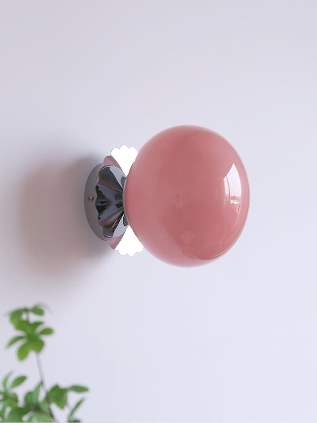 Rounded glass sconce mounted as a flush ceiling light