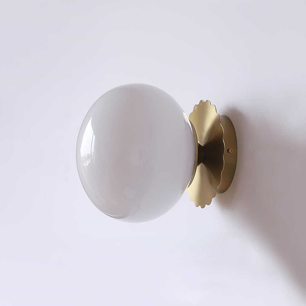 Marshmallow wall sconce with tinted glass diffuser and metal body