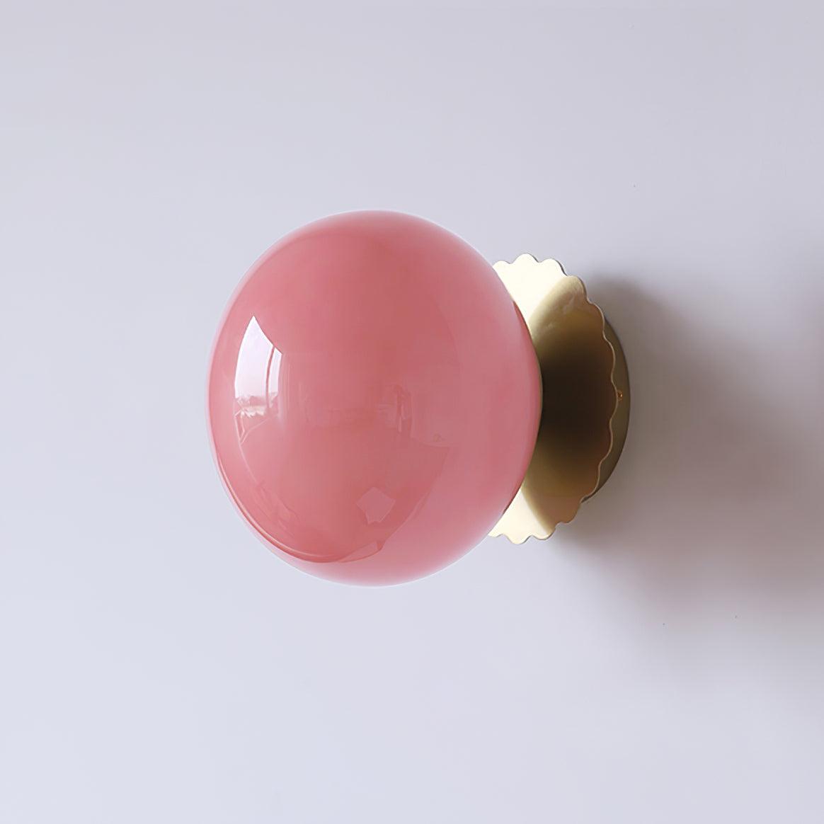 Glass-diffuser sconce with rounded shade and slim metal base