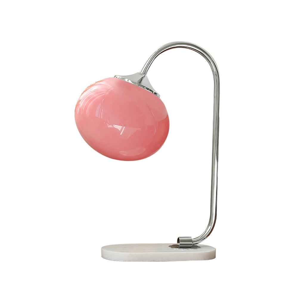 Clérachic pastel glass table lamp with a pink glass shade on a chrome arm and marble base, shown unlit on a plain white backdrop.