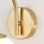 Close view of the copper wall plate and arm on this Clérachic wall light, with the glass shade just visible below.
