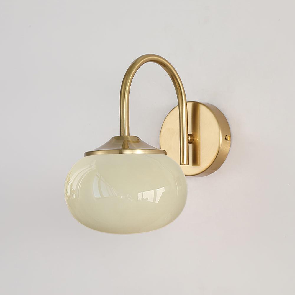 A plain white wall sets off this Clérachic wall light in copper and beige glass, unlit, shown at an angle.