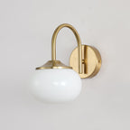 Straight-on view of this Clérachic wall light in copper and white glass, unlit, mounted on plain white.