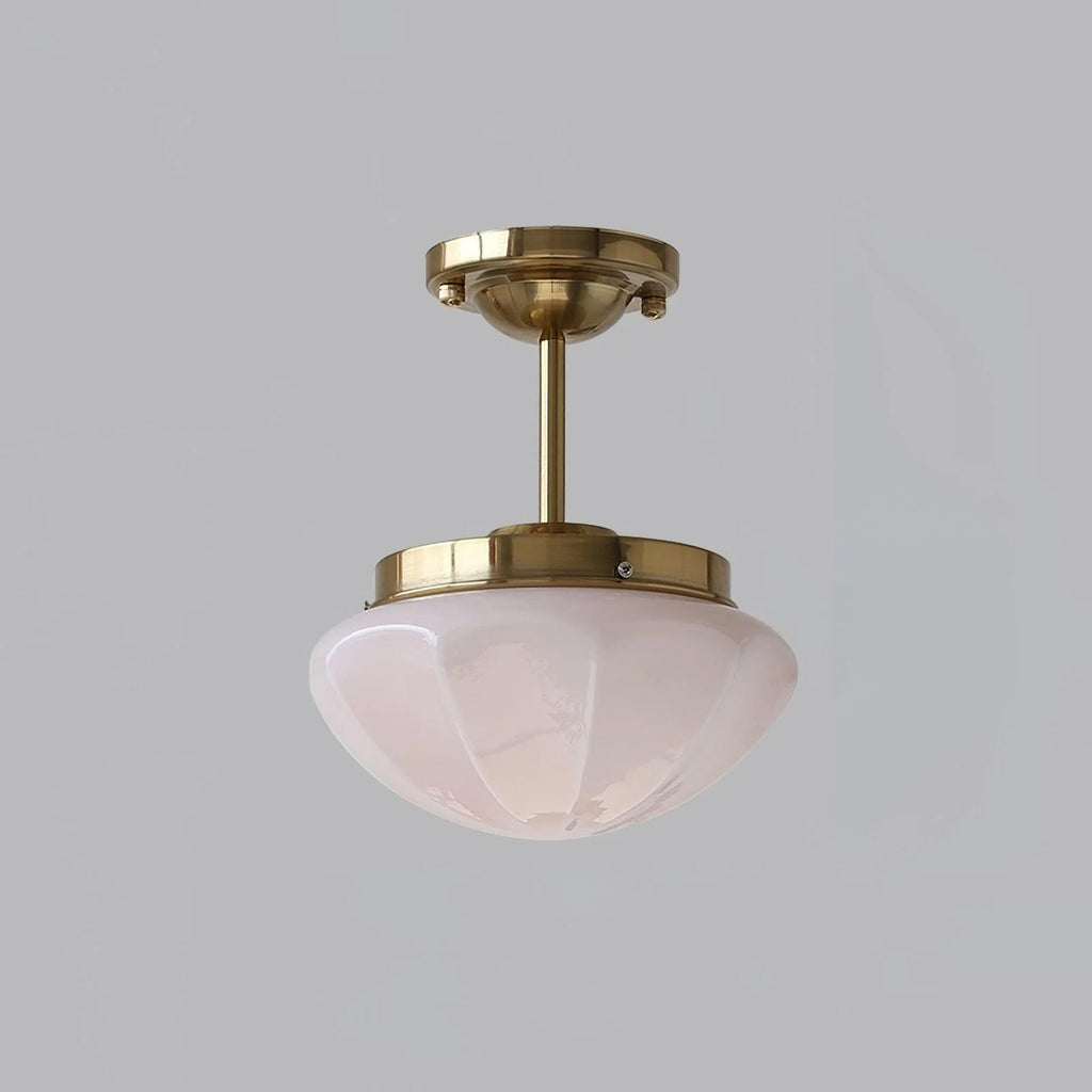 Mini ceiling pendant with glass shade in a cosy interior