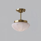 Mini ceiling pendant with glass shade in a cosy interior