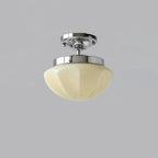 Glass-shade pendant light hanging close to a low ceiling