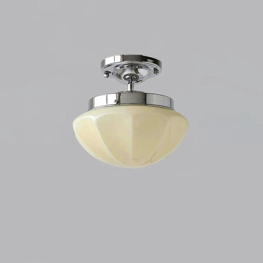 Glass-shade pendant light hanging close to a low ceiling