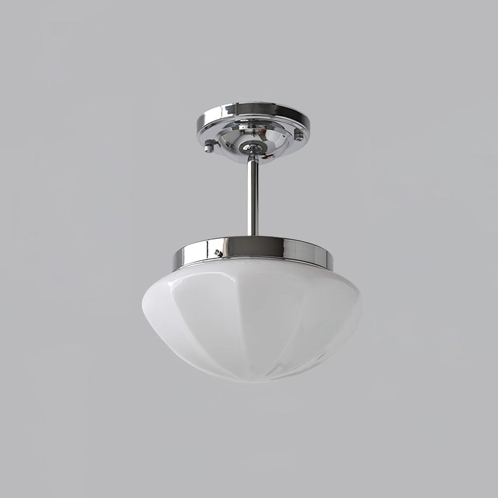 Art Deco pendant light grouped over a styled living space