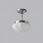 Art Deco pendant light grouped over a styled living space