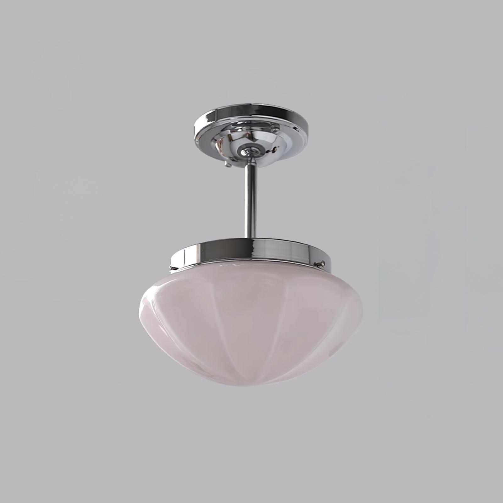 Glass-shade ceiling lights hung at staggered heights together