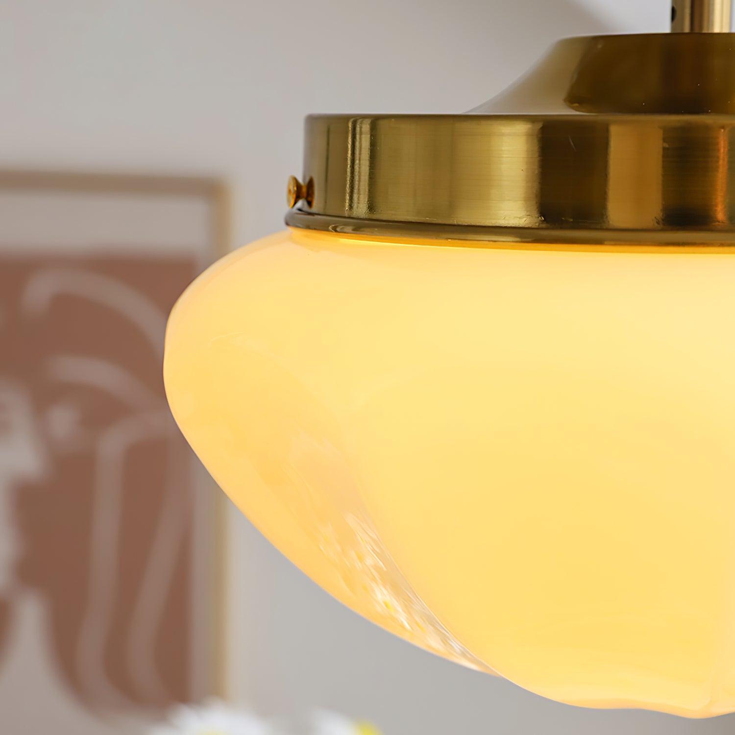 Glass-shade ceiling light glowing softly over an interior