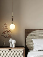 Maru pendant light detail showing ash wood bead grain