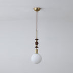 Wood-bead pendant light with glass shade and slim cable