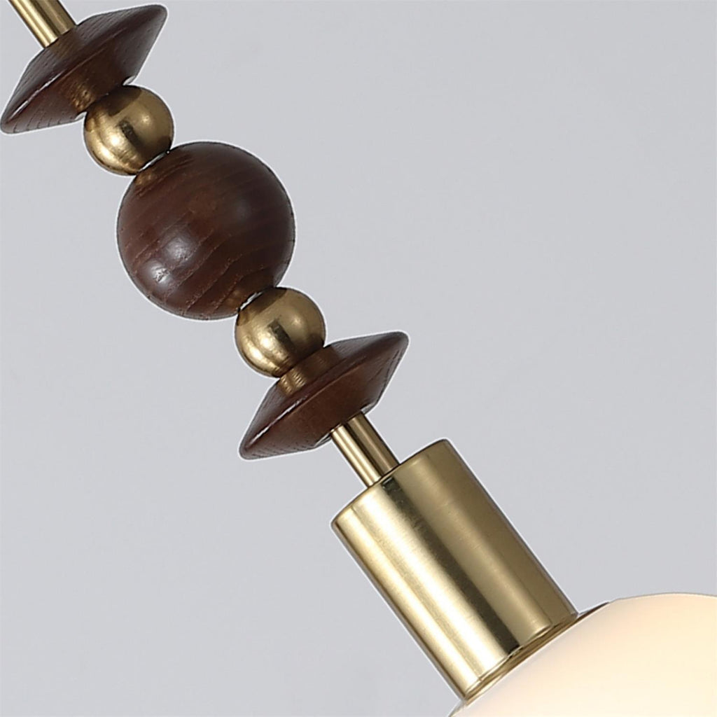 Pendant light with turned wood beads and copper detail
