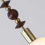 Pendant light with turned wood beads and copper detail
