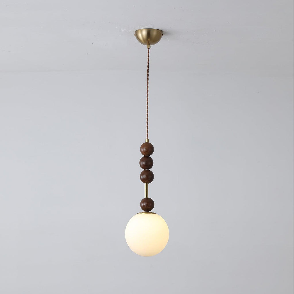 Maru pendant light with strung ash wood beads and glass shade