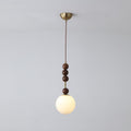 Maru pendant light with strung ash wood beads and glass shade