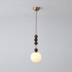 Maru pendant light with strung ash wood beads and glass shade