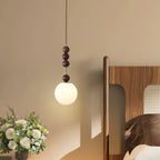 Maru wood-bead pendant light over a styled living space
