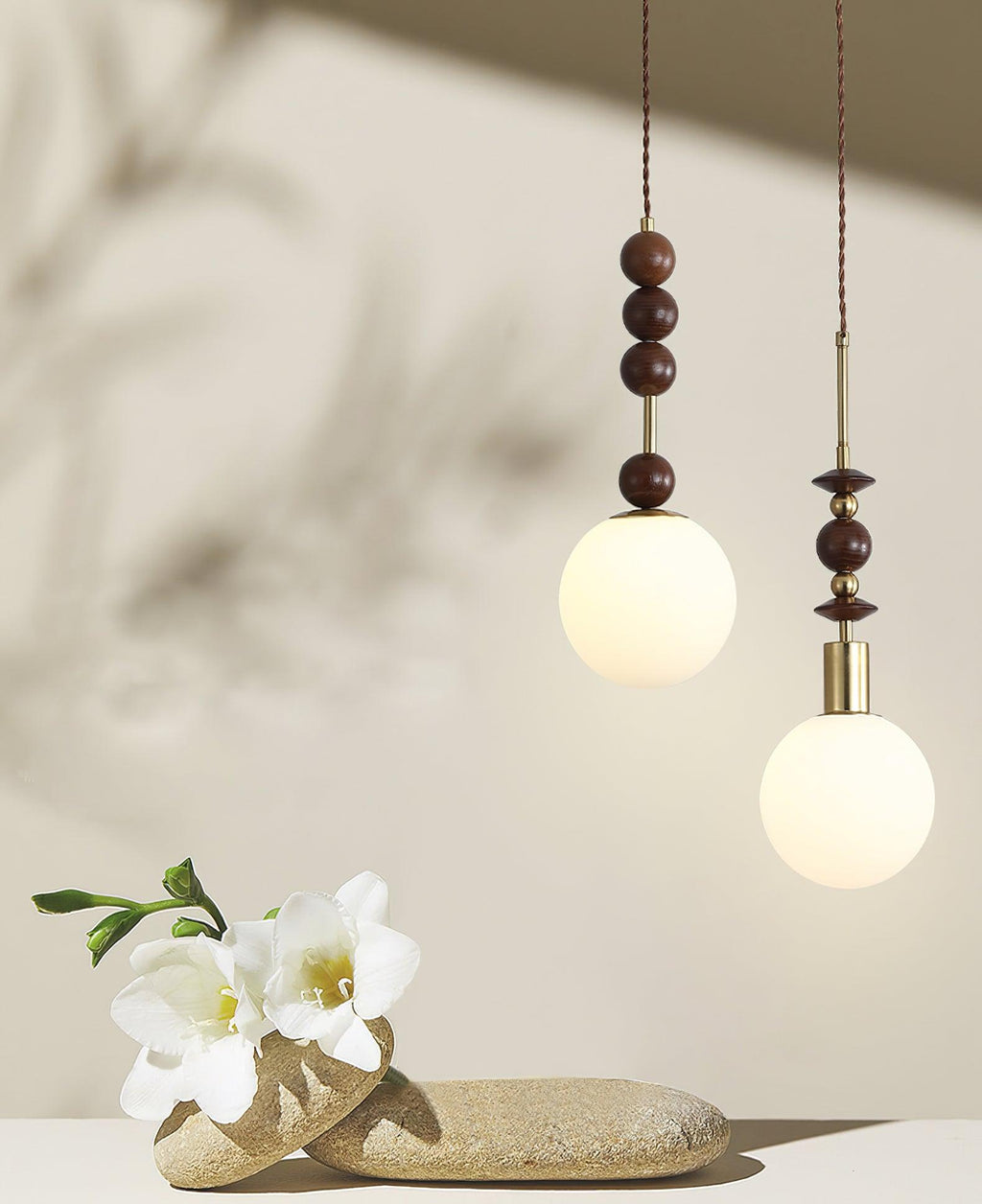 Wood-bead pendant light glowing warm above a table