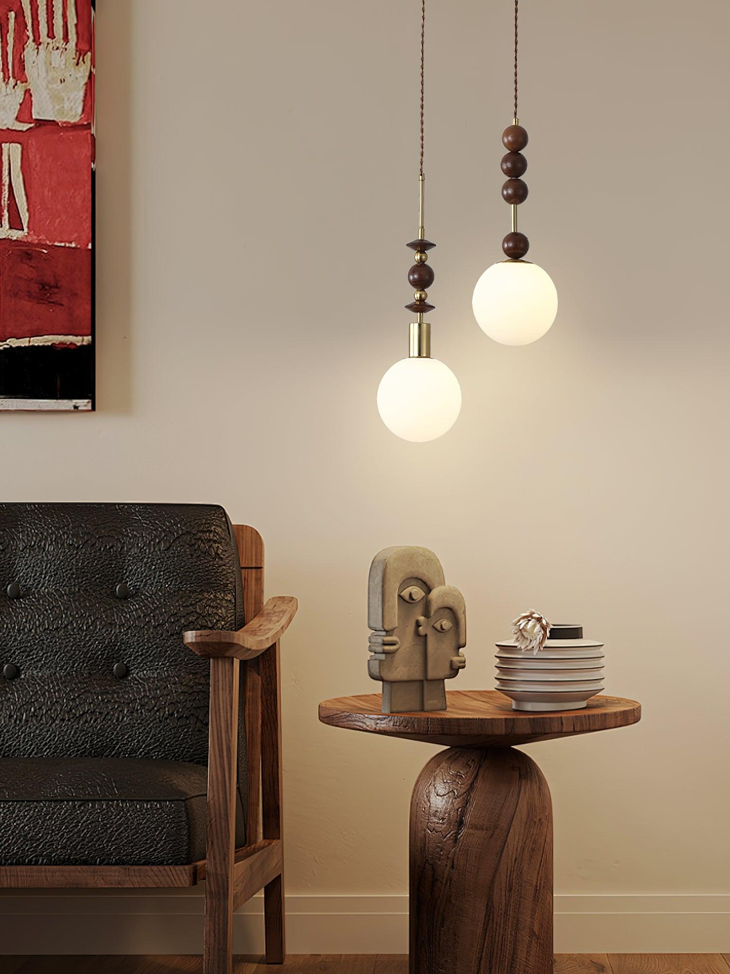 Wood-bead pendant light hanging beside a neutral wall