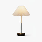 Clérachic pleated-shade table lamp with a black stem and round base, shown alone against a plain white backdrop.