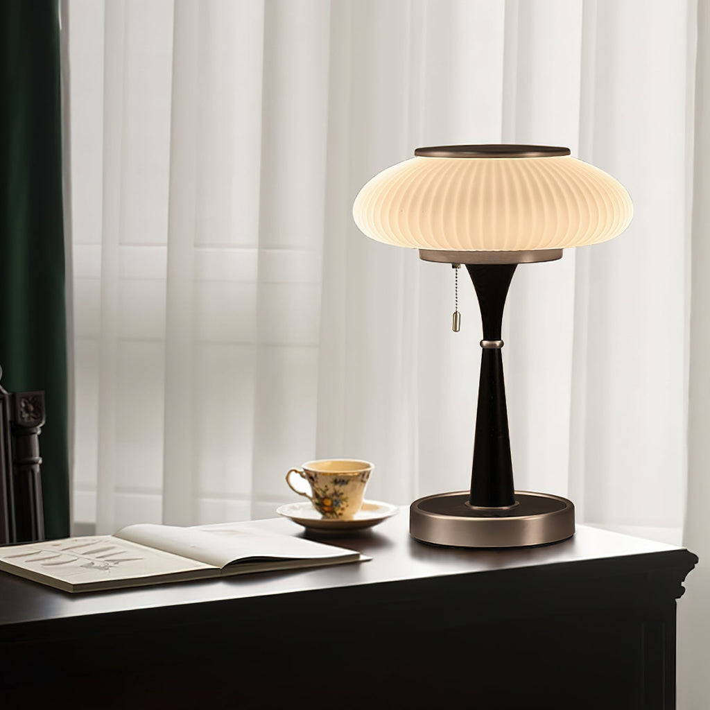 Mushroom-shade table lamp with soft diffused glow at dusk