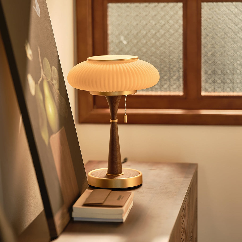 Mushroom glass table lamp casting soft ambient light at night