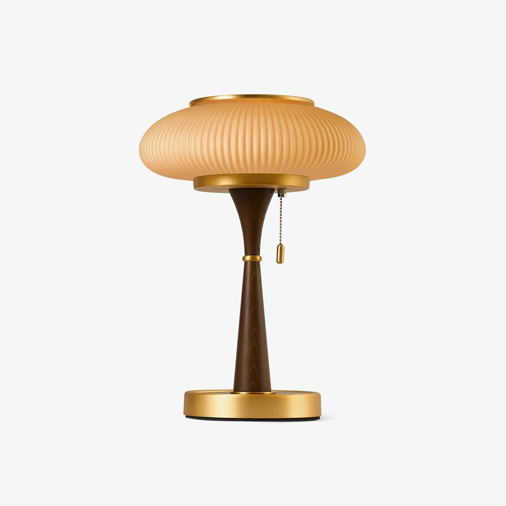 Table lamp with textured glass cap and slender curved base