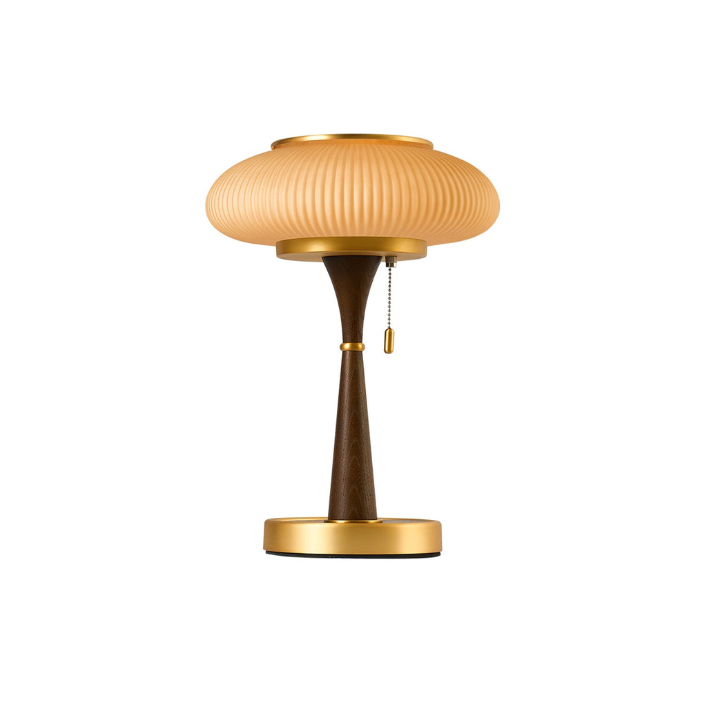 Matsutake table lamp glowing warm beside a soft armchair