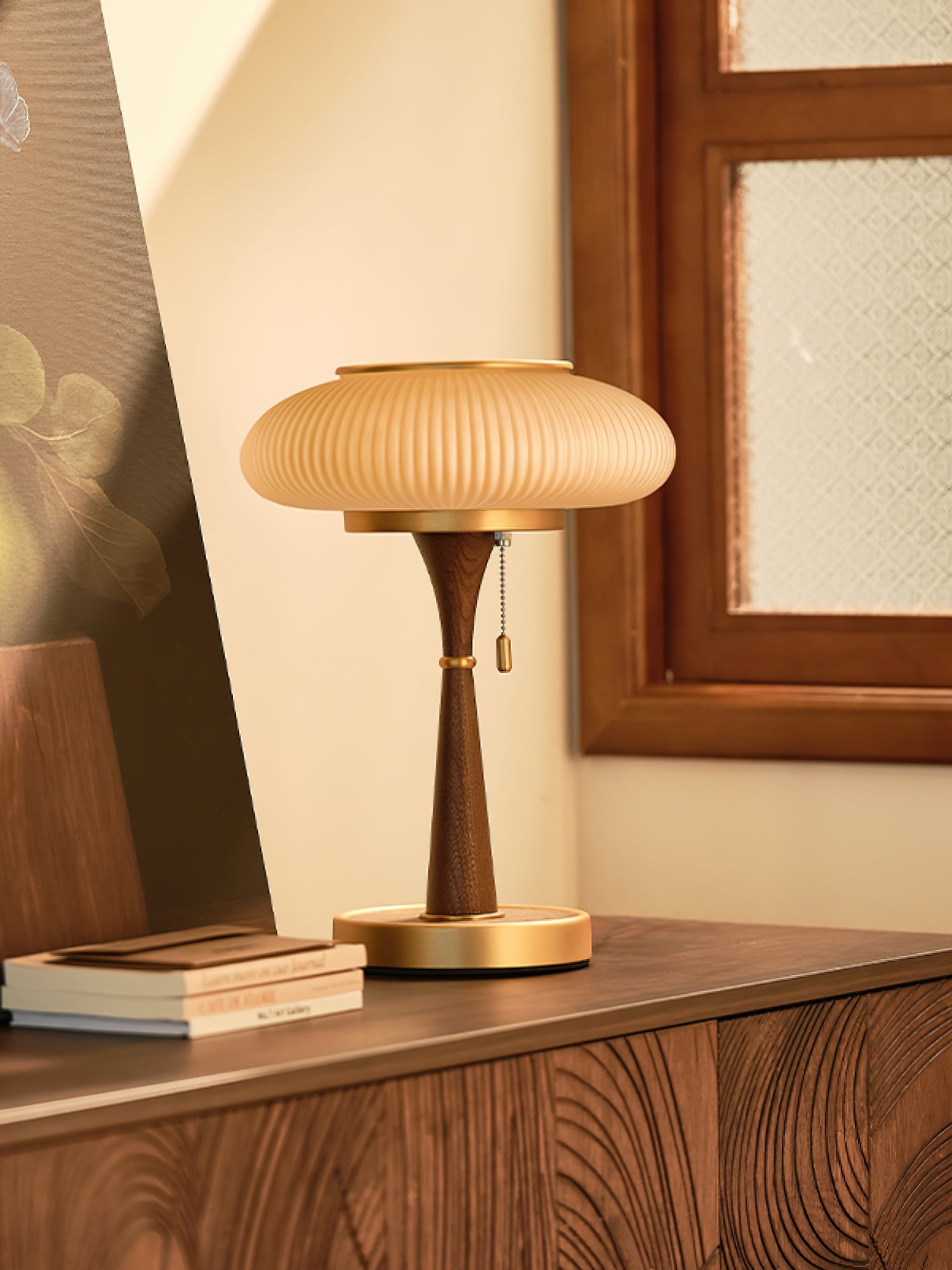 Glass-shade table lamp with curved base casting soft light