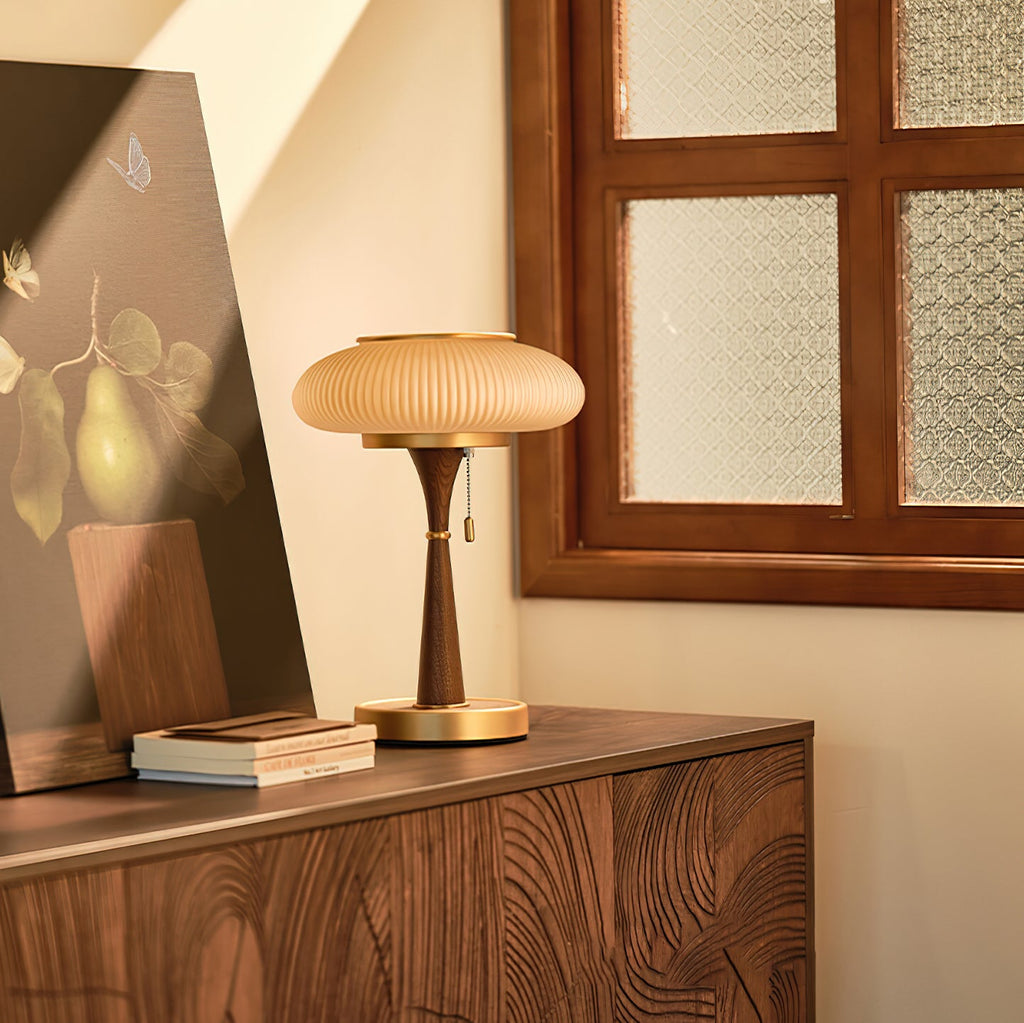 Mushroom-cap table lamp shown lit on a console surface