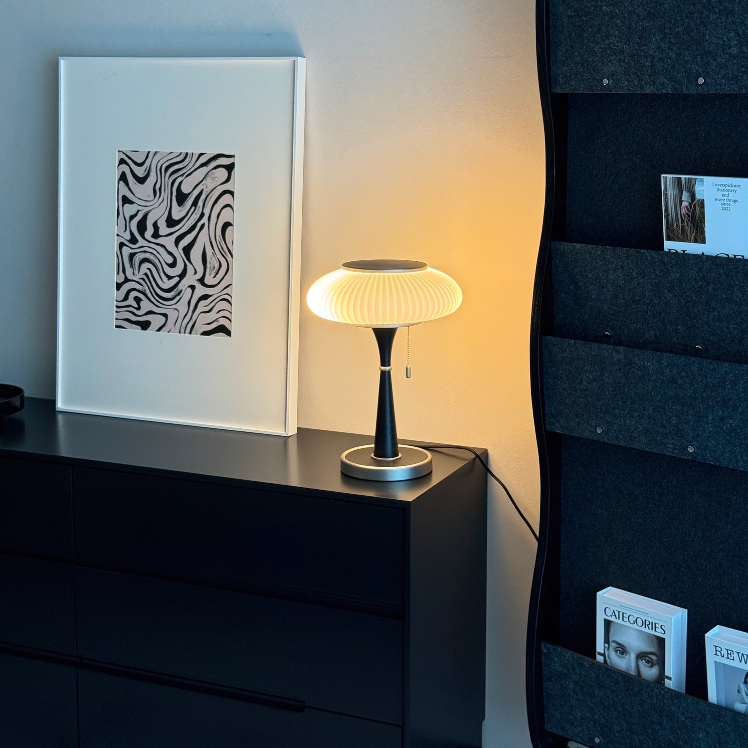Mushroom-cap table lamp with curved base shown unlit