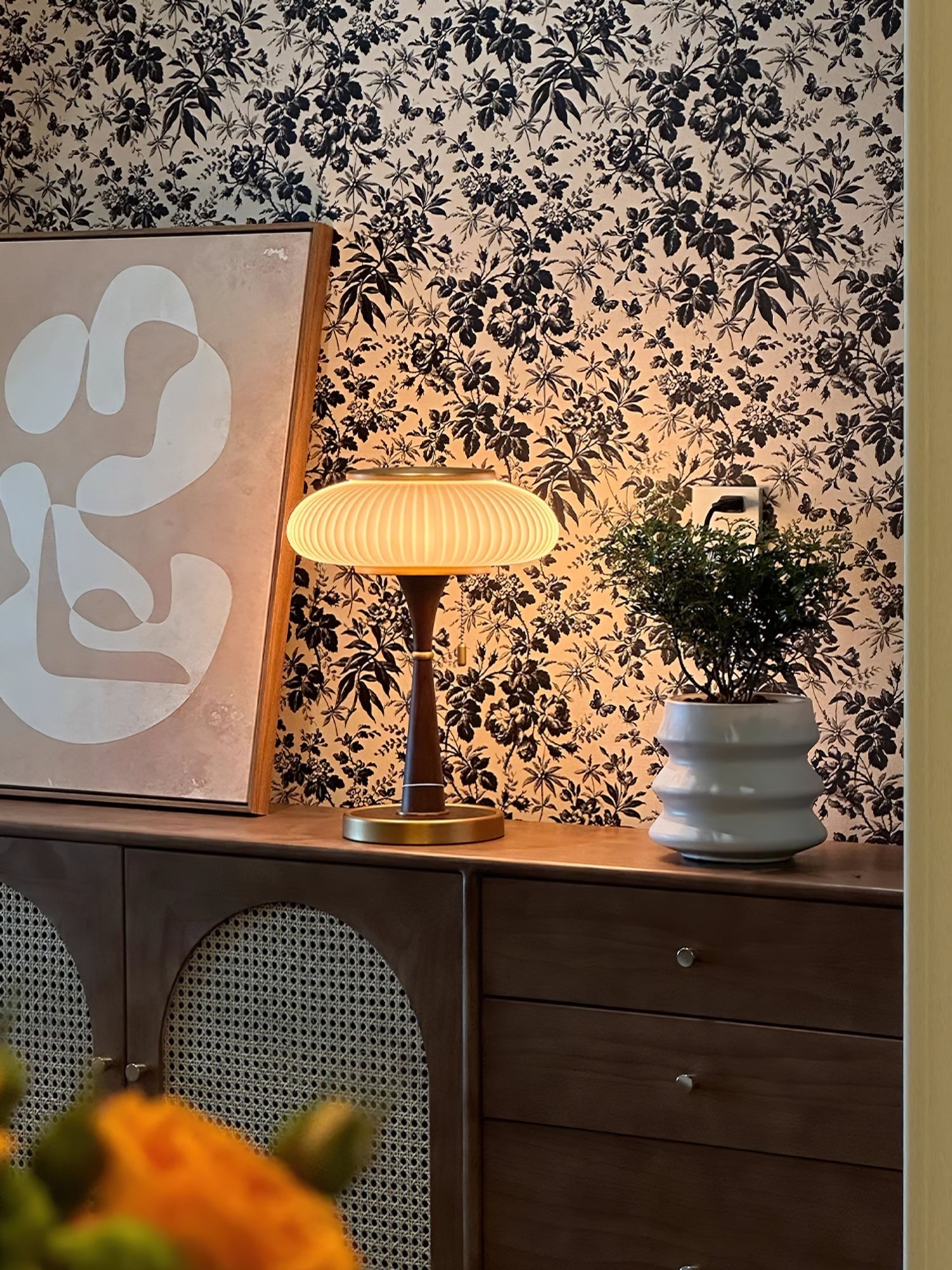 Table lamp with textured glass shade and slim metal base