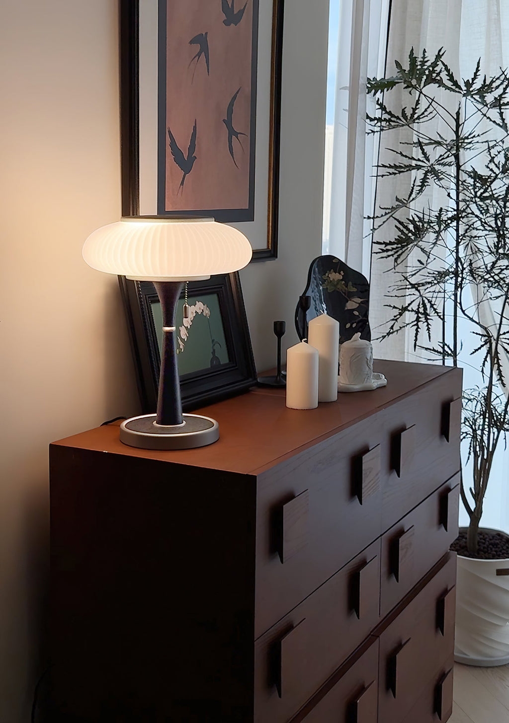 Matsutake table lamp casting ambient light in a styled room