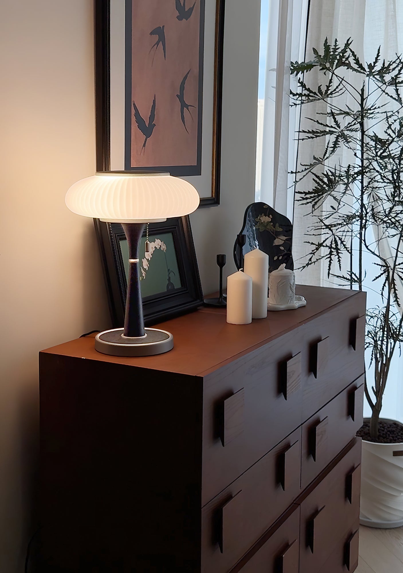 Matsutake table lamp casting ambient light in a styled room