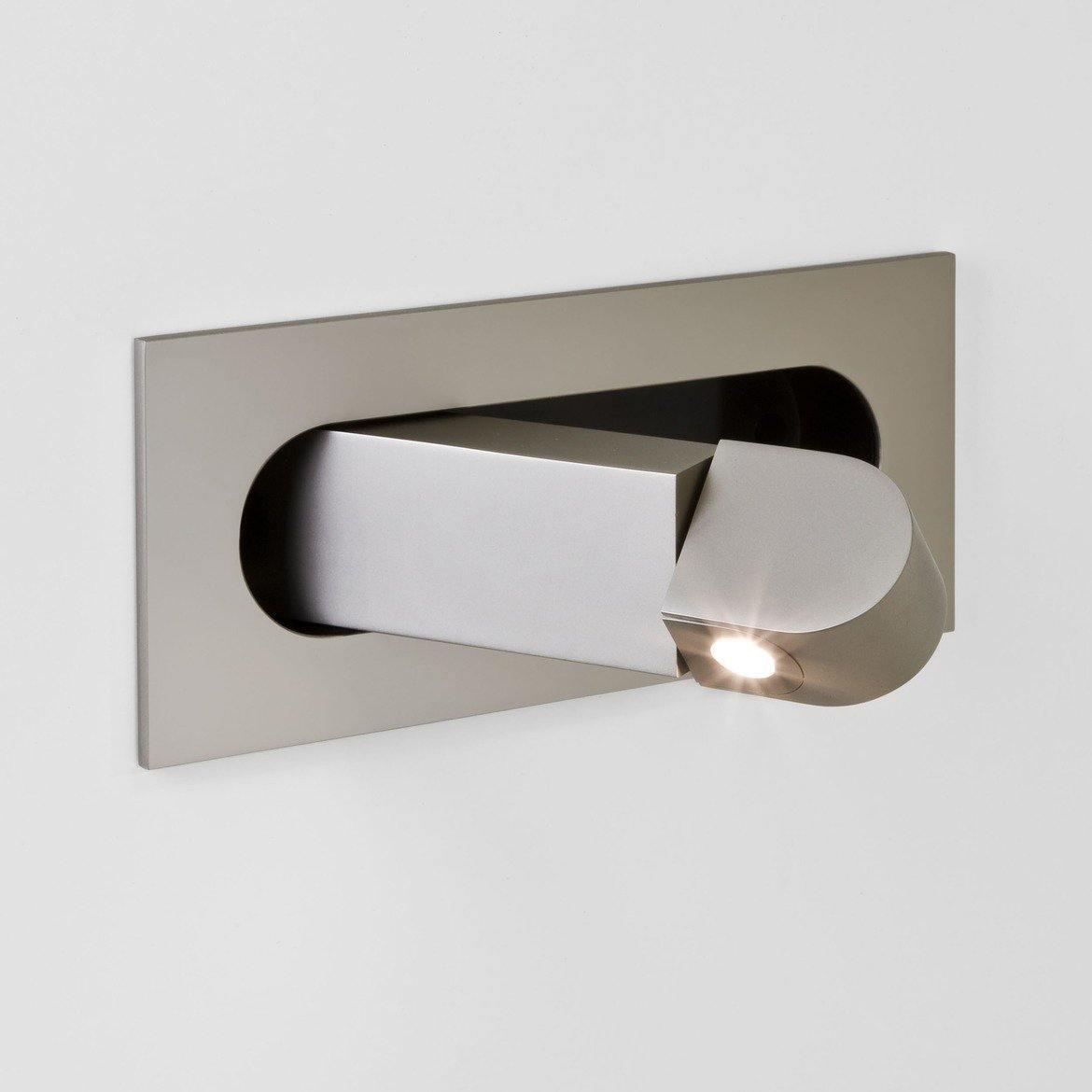 Matt nickel LED bedside reading light mounted beside a bed