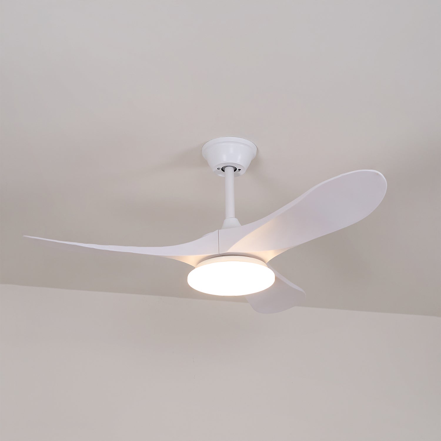 Ceiling fan light with wooden blades casting soft overhead light