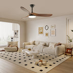 Wooden-blade ceiling fan light mounted over a furnished room