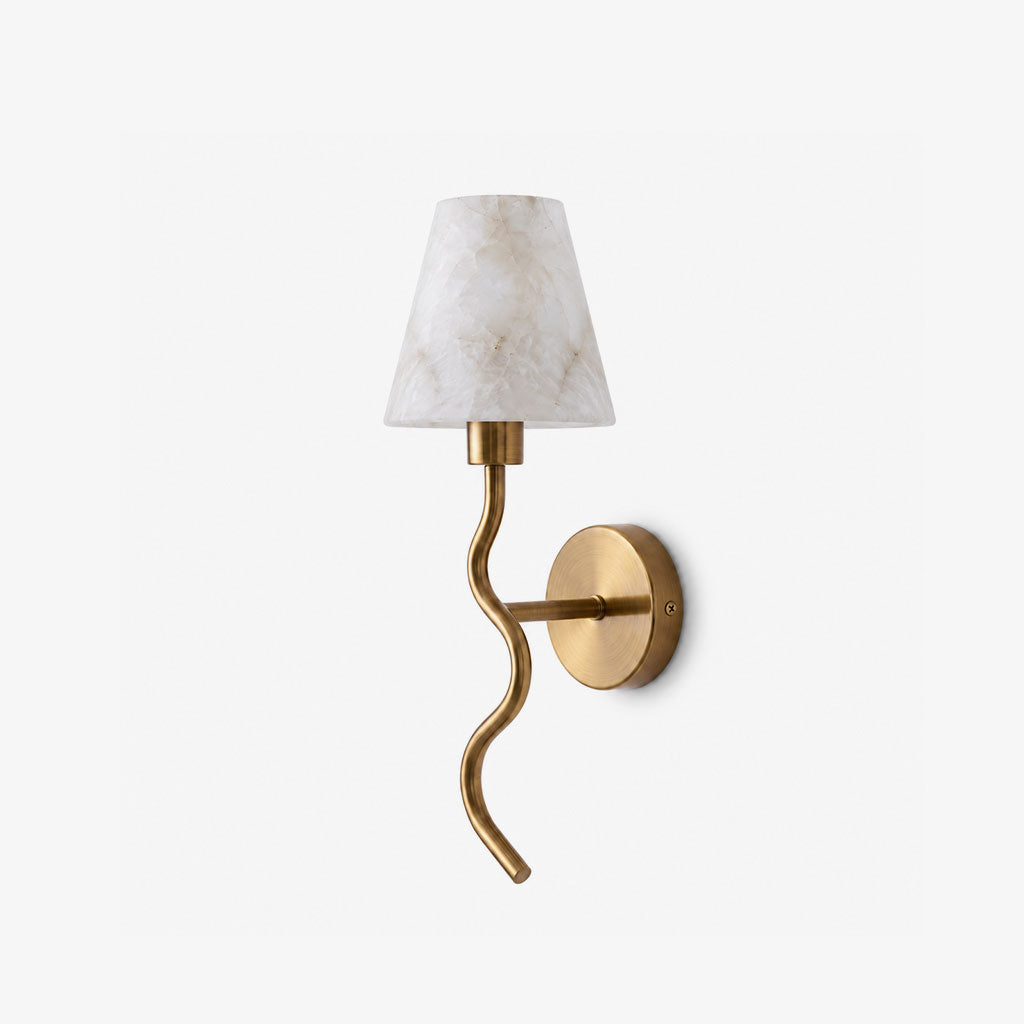 On a plain white backdrop, this Clérachic wall sconce shows its serpentine brushed brass arm beneath a white cone shade, unlit.