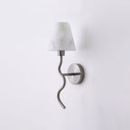 Centred on a plain backdrop, this Clérachic wall sconce's brushed nickel serpentine arm curls beneath a white cone shade, unlit.