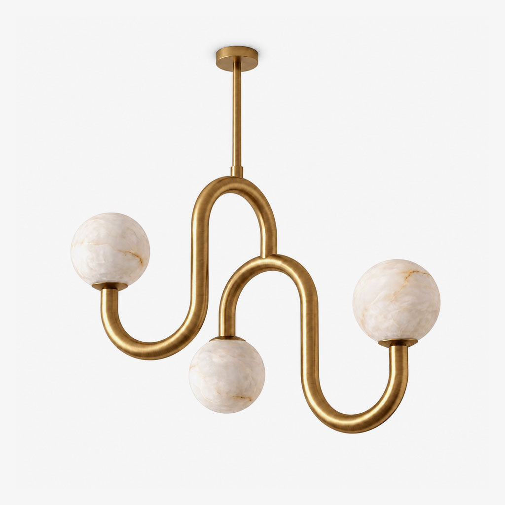 Unlit against a plain white backdrop, the brass finish of this Clérachic chandelier curves twice before ending in three globes.