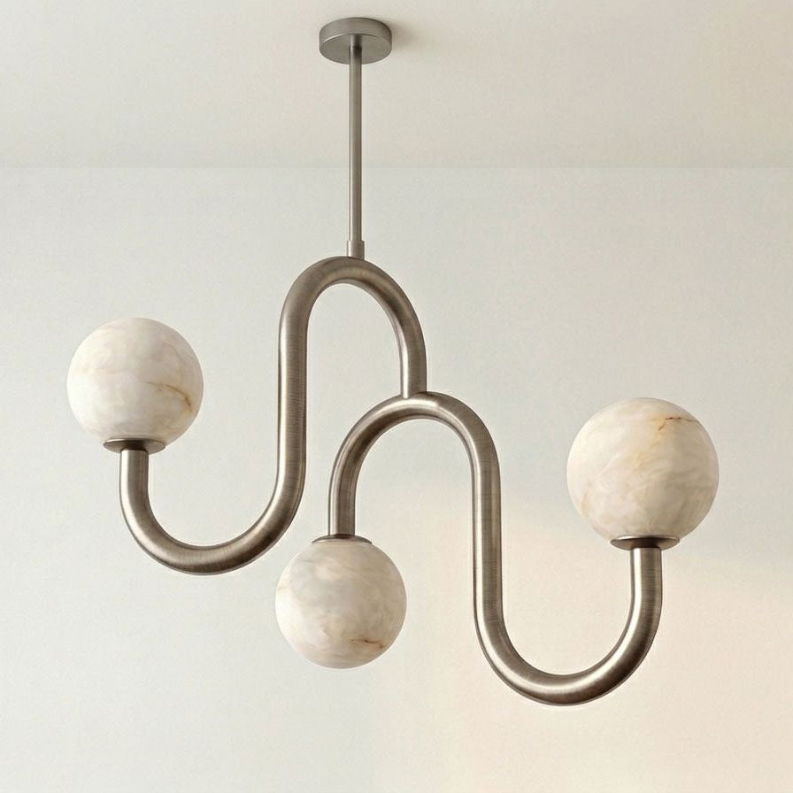 Set on white, this Clérachic chandelier's nickel finish highlights the veining in its three alabaster globes.