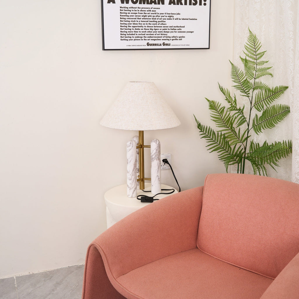 Clérachic table lamp shown again in the corner, from a slightly different angle with more of the armchair in view.